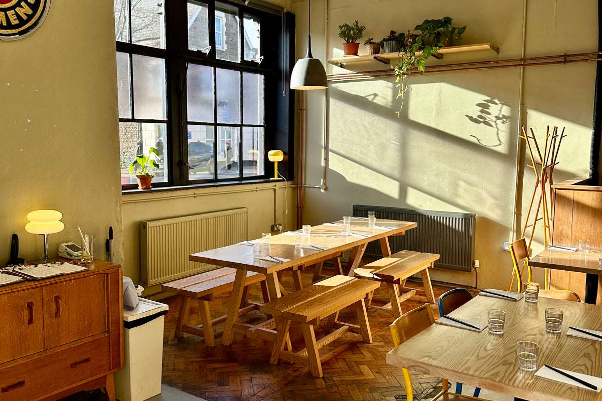 the empty restaurant in the afternoon, big windows, parquet floor