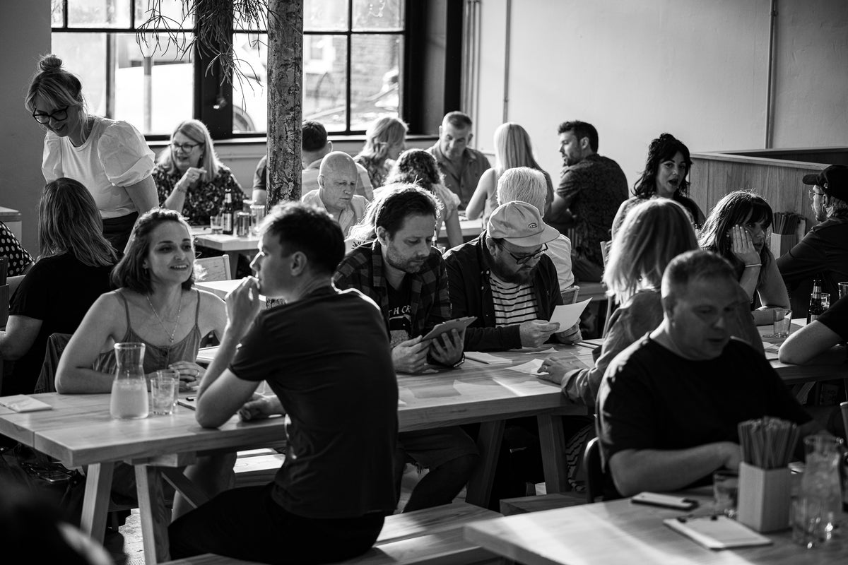 the room full in the daytime, big windows, black and white